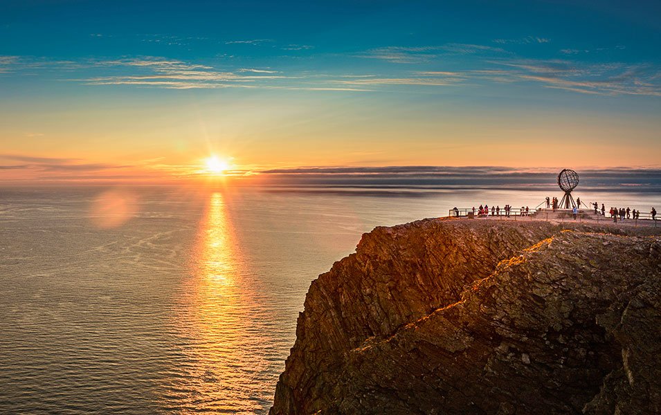 Midnight sun over North Cape with visitors at the iconic globe monument | MSC Cruises Midnight sun over North Cape with visitors at the iconic globe monument | MSC Cruises