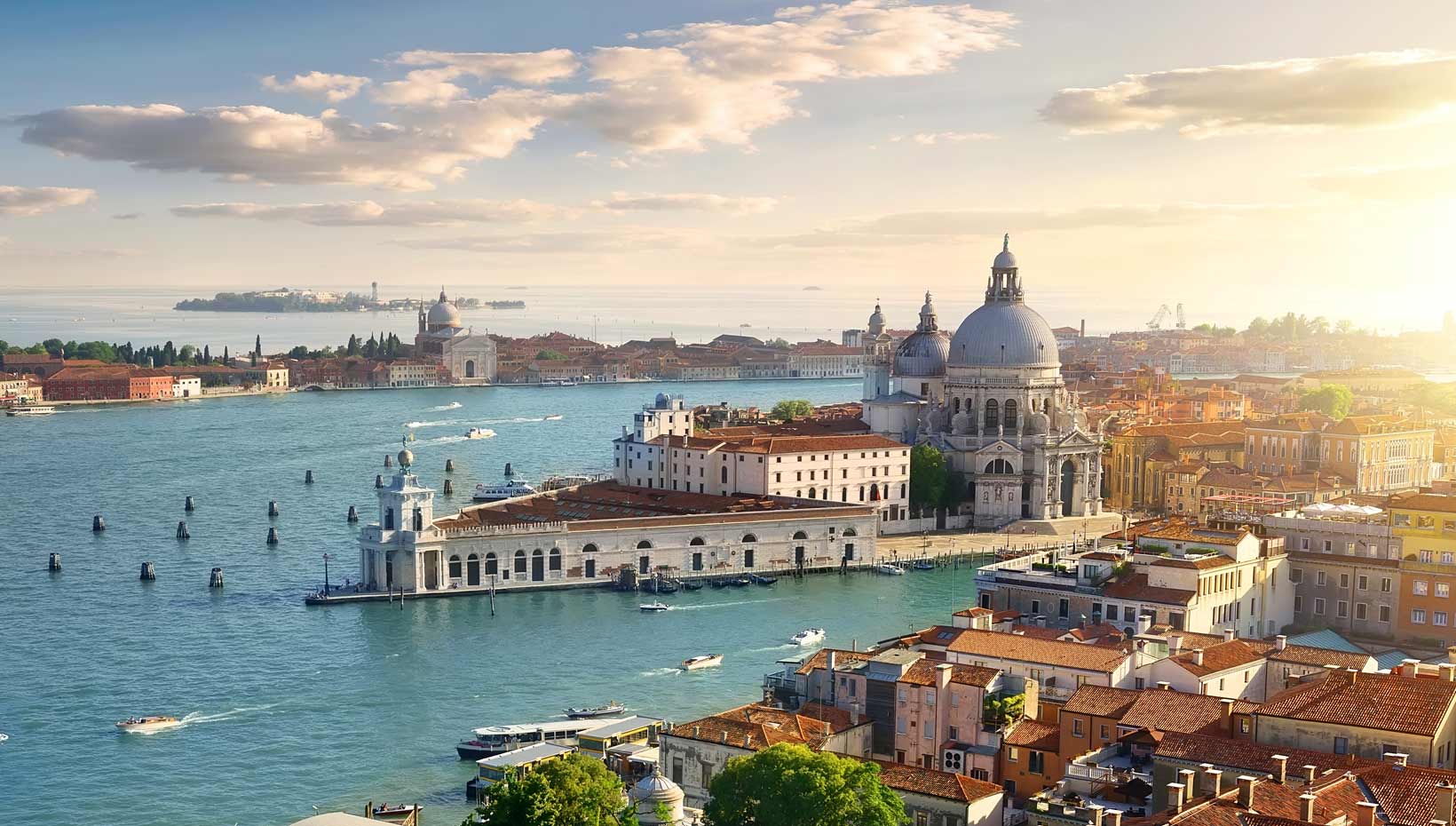 Venice Grand Canal with historic architecture and boats at sunset | MSC Cruises Venice Grand Canal with historic architecture and boats at sunset | MSC Cruises